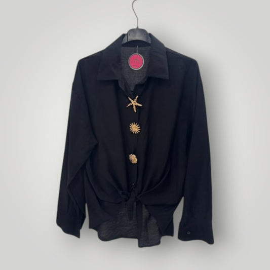 Blusa negra con botones joya