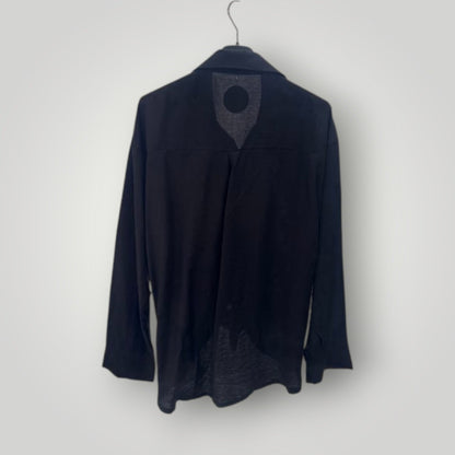 Blusa negra con botones joya